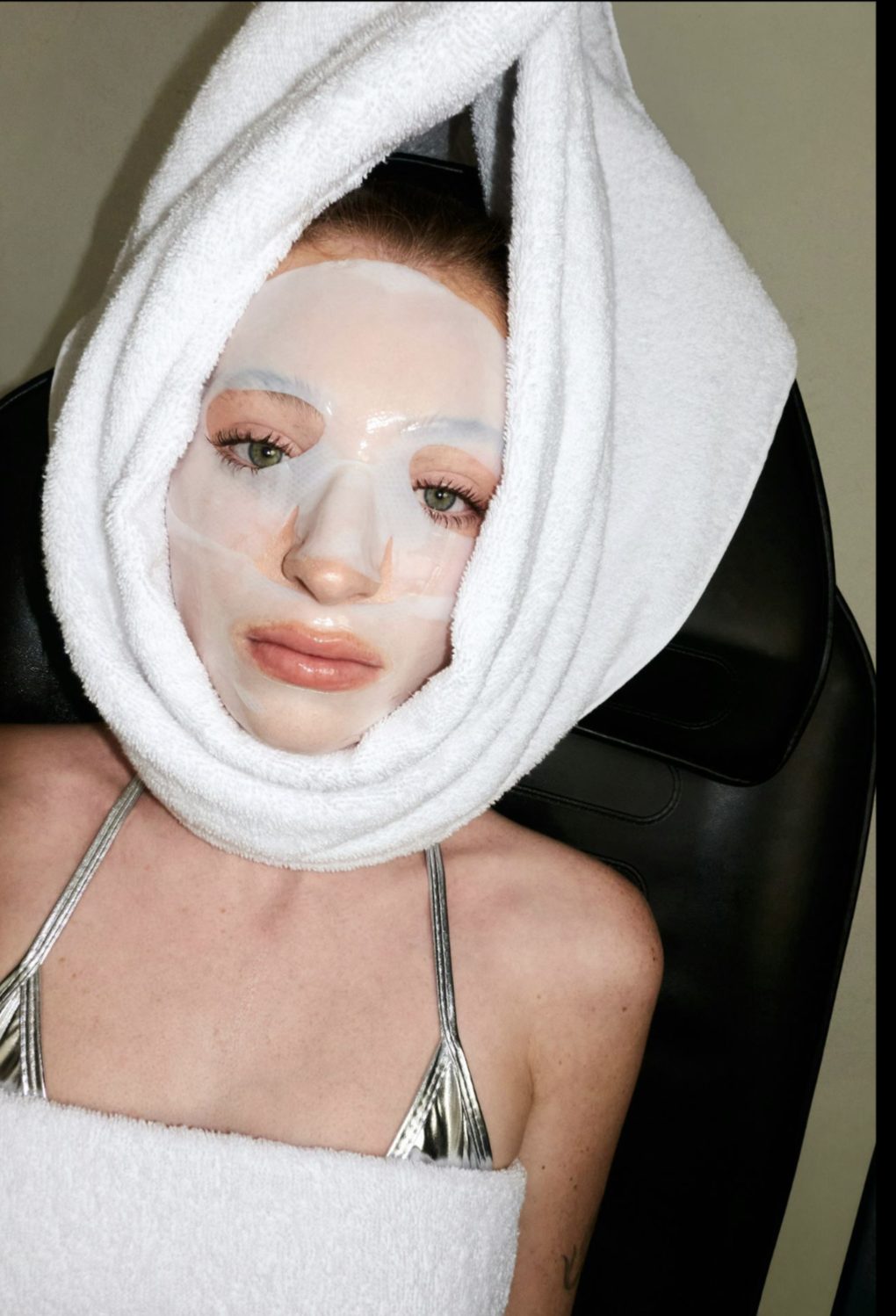 Woman in a towel wrap after a facial treatment